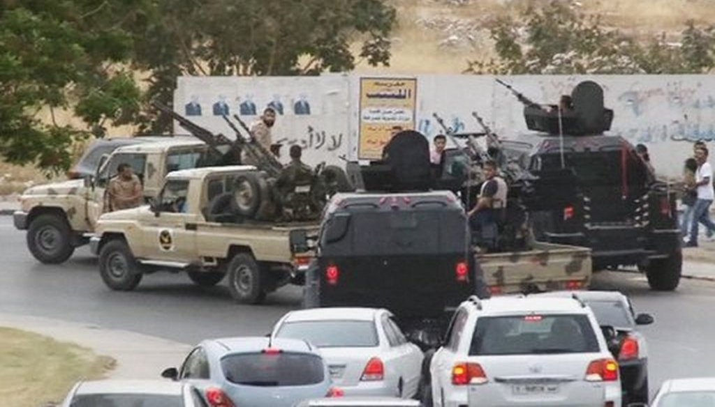 Vehicles with heavy artillery of the Tripoli joint security forces move closer to Libya's parliament after troops of Gen. Khalifa Hifter targeted Islamist lawmakers and officials, on May 18, 2014. (AP/Libyan national army)