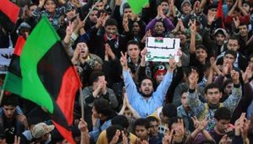 Rebel supporters cheer during a celebratory rally after the United Nations approved a no-fly zone over the country on March 18, 2011, in Tobruk, Libya.