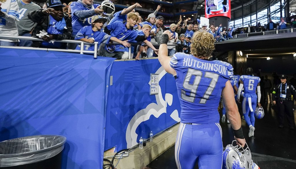 Detroit Lions defensive end Aidan Hutchinson is greeted by fans as he walks to the locker room after winning an NFL football game against the Carolina Panthers in Detroit, Oct. 8, 2023. (AP)