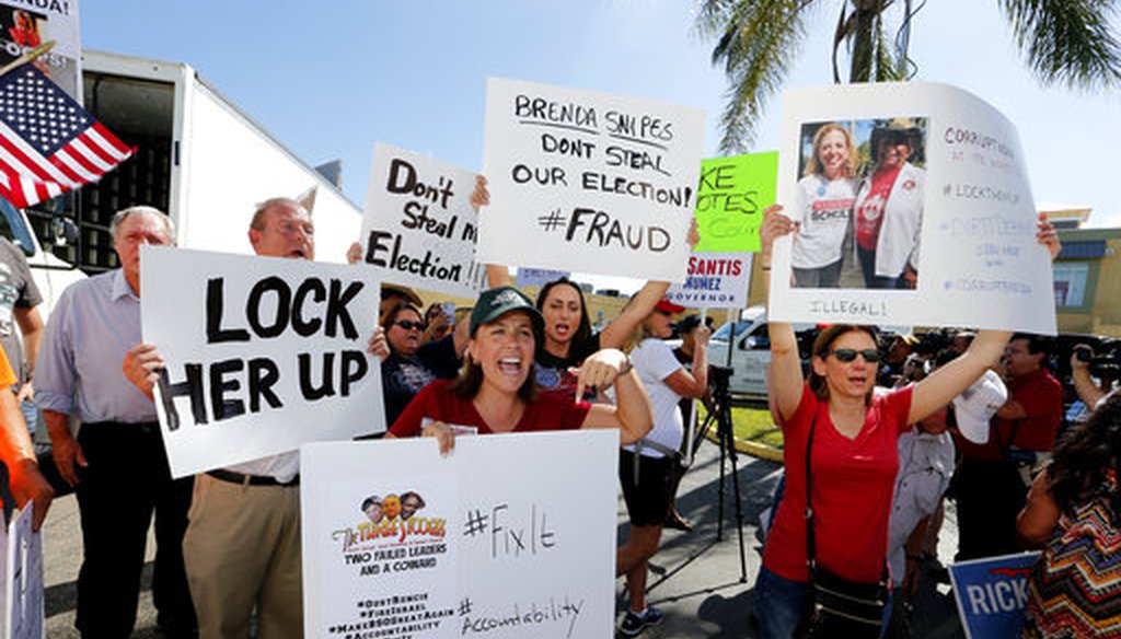 A crowd protests outside the Broward County Supervisor of Elections office Friday, Nov. 9, 2018, in Lauderhill, Fla. (AP)