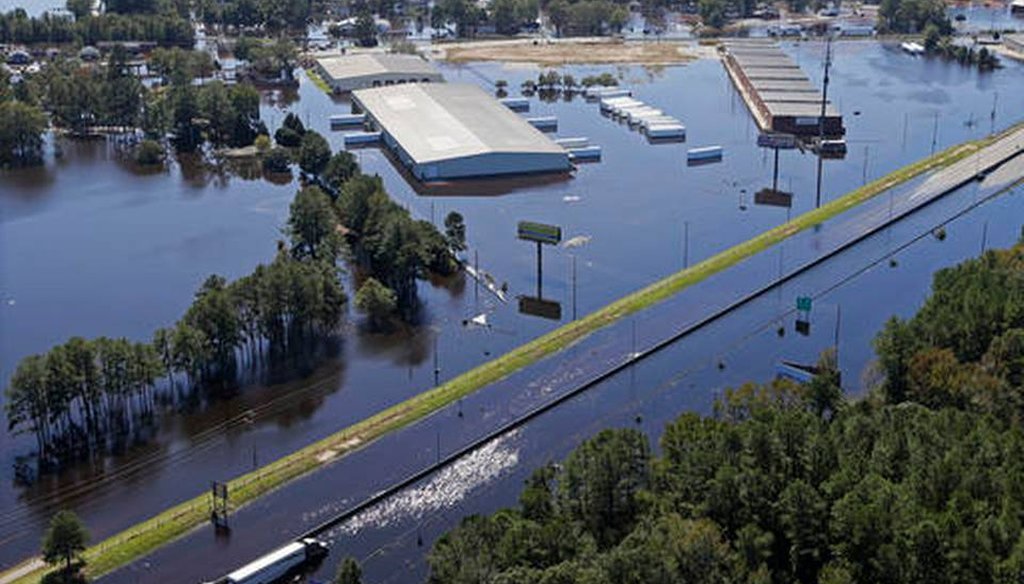 A stretch of I-95 in Lumberton, N.C., was flooded along with nearby buildings after Hurricane Matthew hit the state. Raleigh News & Observer photo.