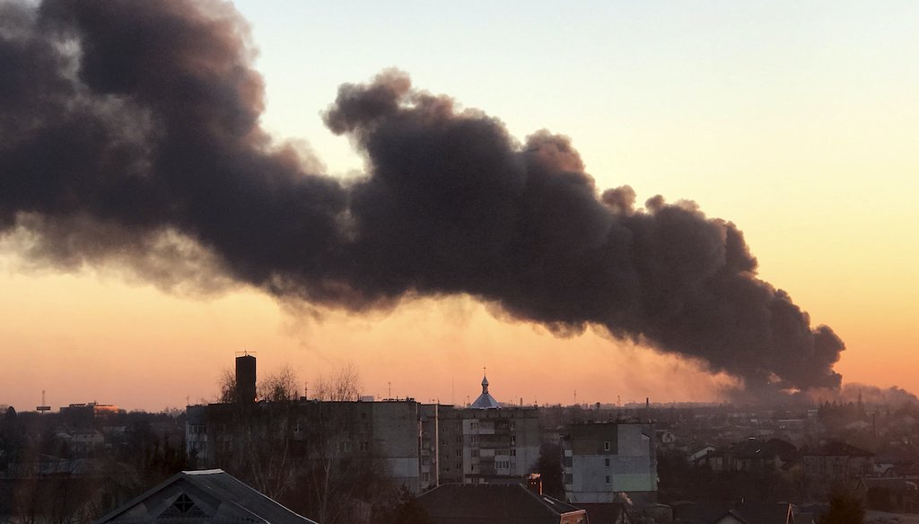 A cloud of smoke raises after an explosion in Lviv, western Ukraine, Friday, March 18, 2022. The mayor of Lviv says missiles struck near the city's airport early Friday. (AP)