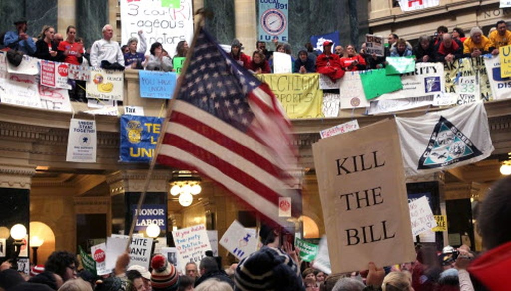 Protesters demonstrate in the Capitol rotunda on Feb. 26, 2011, in Madison. Demonstrators occupied the building for days protesting a bill that would restrict collective bargaining.