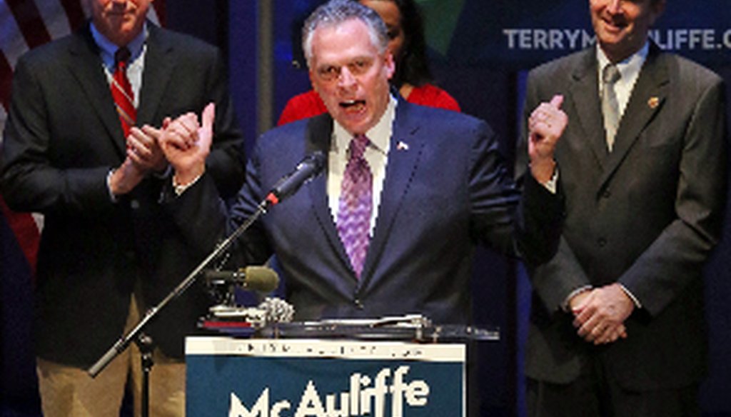 Democratic gubernatorial candidate Terry McAuliffe, center, at a June 12 Richmond campaign rally with his running mates, Mark Herring, left, and Ralph Northan, right.  