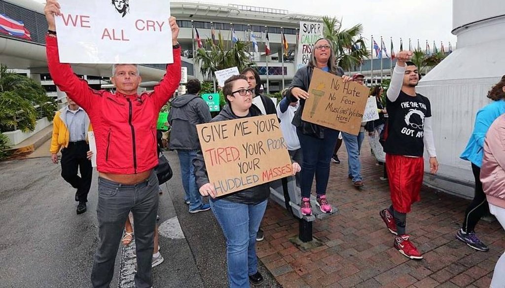 Protesters have their say against President Trump's executive orders on immigration during a rally at Miami International Airport on Sunday, January 29, 2017. (Miami Herald) 