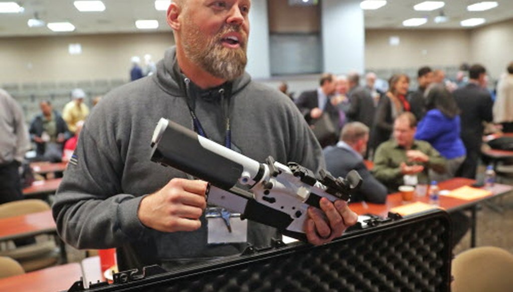 Will Murphy, president of Gun Guardian, talks about an AR 15 rifle with a prototype trigger shield during the Firearm Safety Expo at Milwaukee Area Technology College in Oak Creek Jan. 16, 2019.  Mike De Sisti / Milwaukee Journal Sentinel