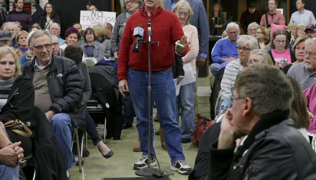 Residents of Paul Ryan's congressional district in southeast Wisconsin speak at a "town hall" meeting organized by the group Forward Kenosha. Ryan did not attend the event. (Mike De Sisti)