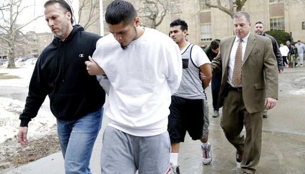 Suspected members of the MS-13 gang are escorted to their arraignment in Mineola, N.Y., on Jan. 11, 2018. (AP Photo/Seth Wenig)