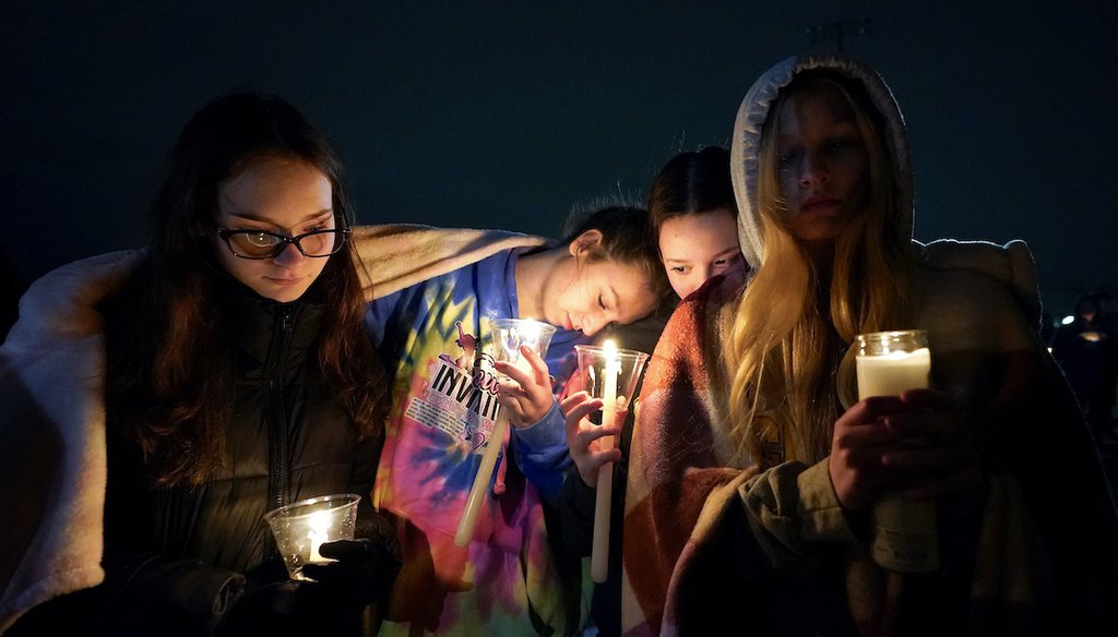 Mourners attend a candlelight vigil for Alexandria Verner at the Clawson High School football field in Clawson, Mich., Tuesday, Feb. 14, 2023. Verner was among the students killed by a gunman at Michigan State University Monday night. (AP)
