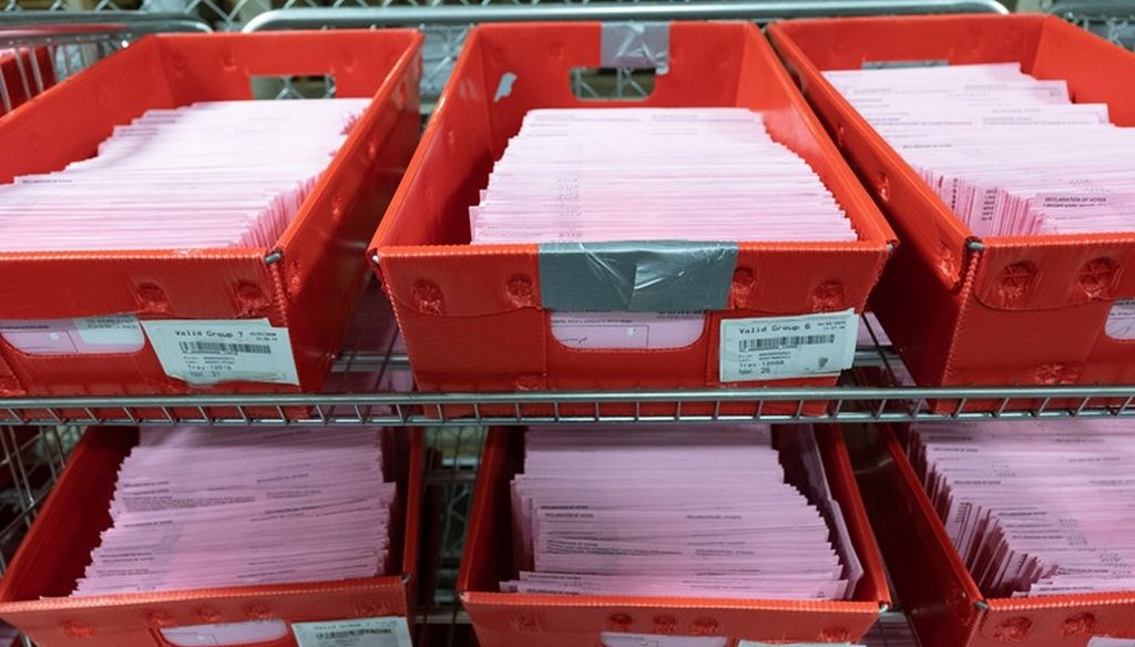 Vote-by-mail ballots wait to be opened at the county registrar's office in Sacramento, Calif., on March 3, 2020. Andrew Nixon / CapRadio