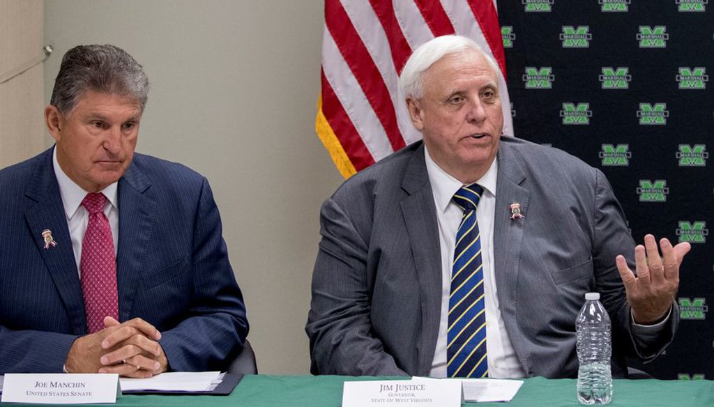 Sen. Joe Manchin, D-W.Va., and West Virginia Gov. Jim Justice attend a roundtable on the opioid epidemic at Cabell-Huntington Health Center in Huntington, W.Va., on July 8, 2019. (AP)