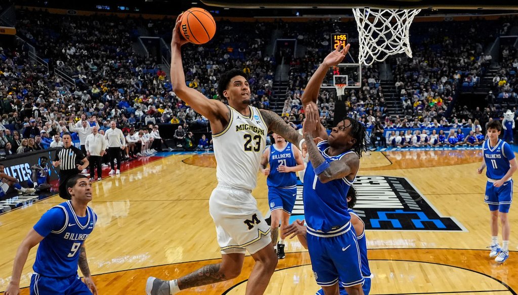 Michigan forward Yaxel Lendeborg (23) dunks over Saint Louis guard Quentin Jones (1) during the first half in the second round of the NCAA college basketball tournament, Saturday, March 21, 2026, in Buffalo, N.Y. (AP)