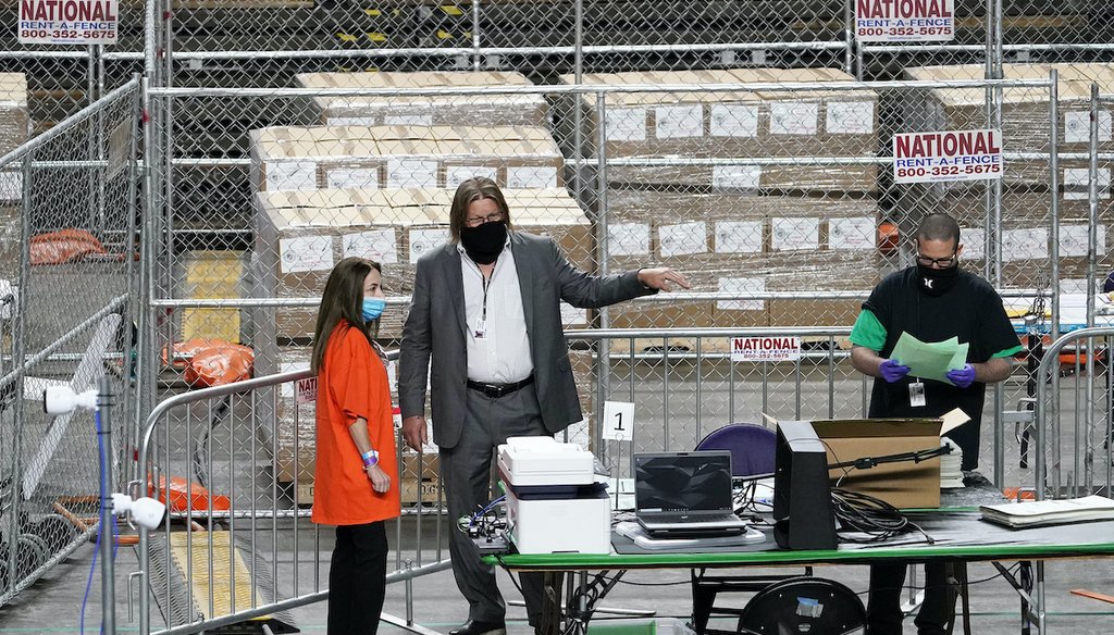 Maricopa County ballots cast in November are being recounted by contractors under a recount launched by the Arizona State Senate at Veterans Memorial Coliseum in Phoenix,  April 29. (Arizona Republic via AP)