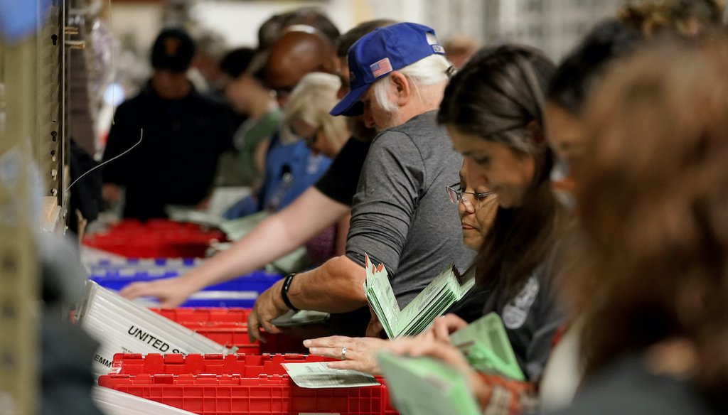 Election workers sort early ballots for signature verification prior to tabulation inside the Maricopa County Recorders Office, Tuesday, Nov. 8, 2022, in Phoenix. (AP)