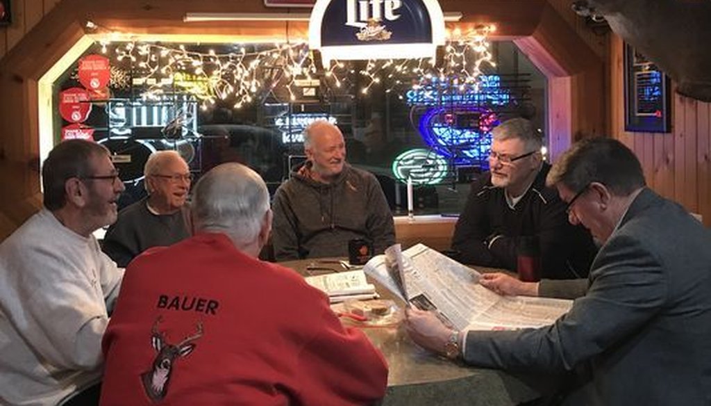 The GOP tax plan is touted as a boost for the economy, but even people in "Trump country," such as this group in Mauston, Wis., have shown little enthusiasm for it. (Craig Gilbert/Milwaukee Journal Sentinel)