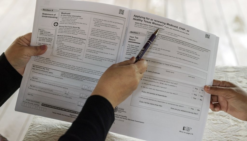 Children's Defense Fund Program Director Graciela Camarena assists Lucia Salazar with filling out Medicaid and SNAP application forms for her family in Pharr, Texas, Nov. 13, 2023. (AP)