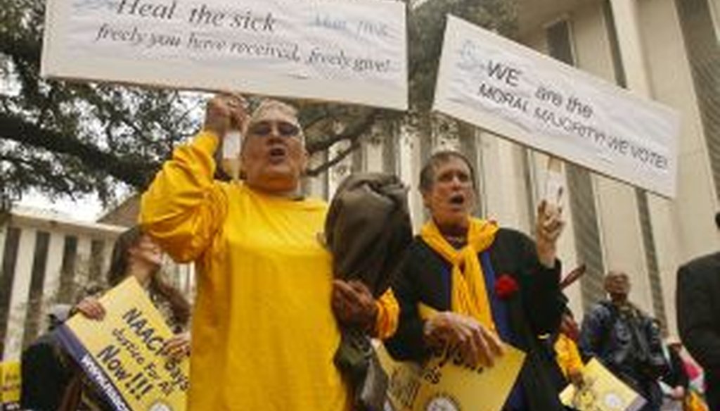 Protestors in Tallahassee, Fla., on March 3 urge the Florida Legislature to expand Medicaid. (AP Photo)