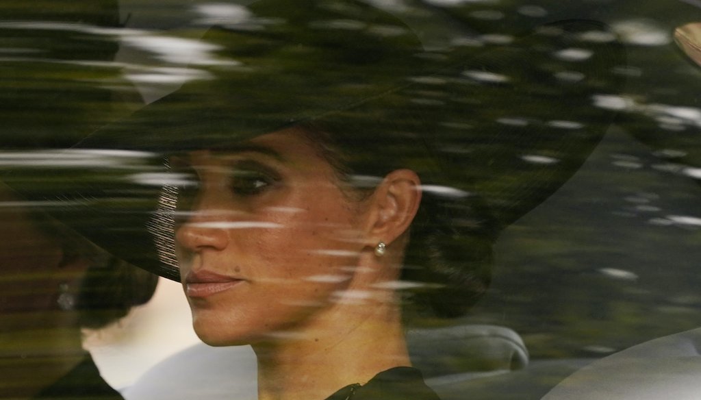 Meghan, the Duchess of Sussex, is driven following the coffin of Queen Elizabeth II after the queen's funeral service in Westminster Abbey, in central London Monday Sept. 19, 2022. (AP)