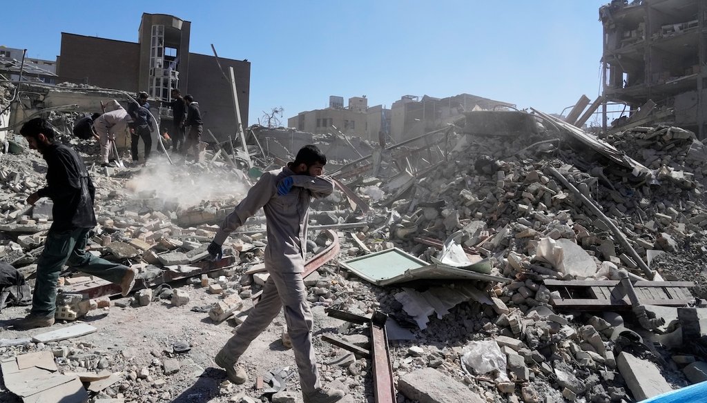 A group of men inspects the ruins of a police station struck Monday amid the U.S.–Israeli military campaign in Tehran, Iran, March 3, 2026.  (AP)