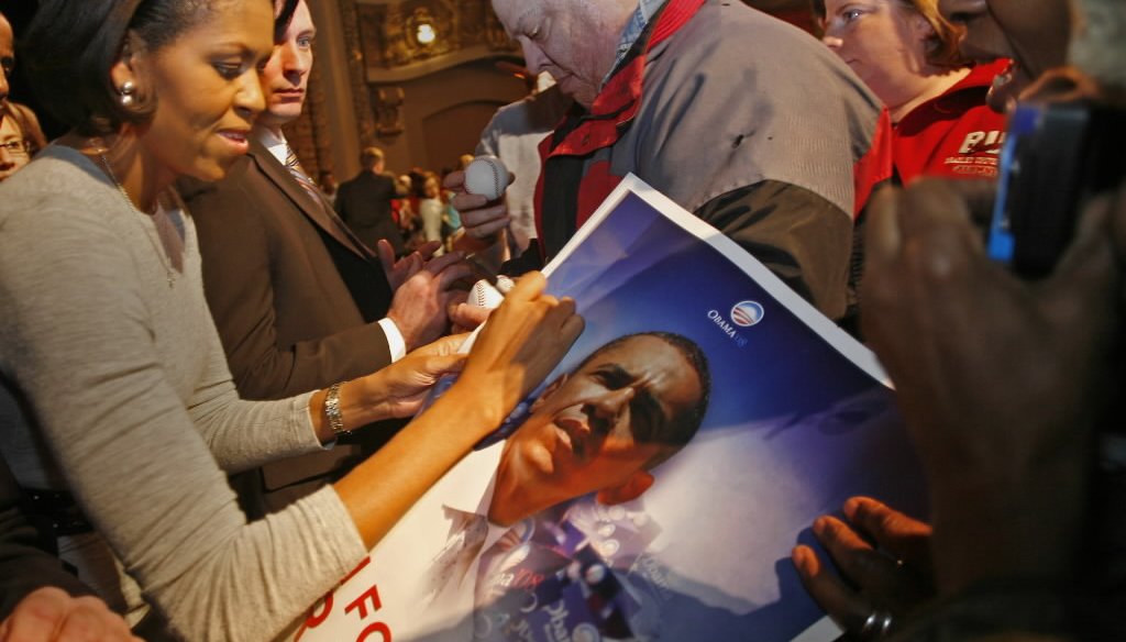 Michelle Obama signed an autograph after giving a campaign speech for Barack Obama in Milwaukee on Feb. 18, 2008, before her husband was elected president. (Milwaukee Journal Sentinel)