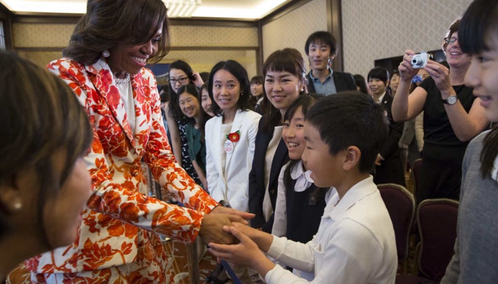 First lady Michelle Obama greets students following the Let Girls Learn announcement at the Iikura Guest House in Tokyo, Japan, March 19, 2015. (White House)