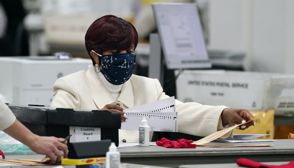 Absentee ballots are processed at the central counting board, Wednesday, Nov. 4, 2020, in Detroit. (AP)