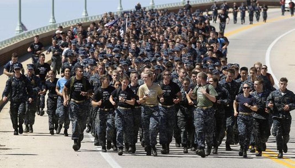 Midshipmen run across a bridge during Sea Trials. (Associated Press)