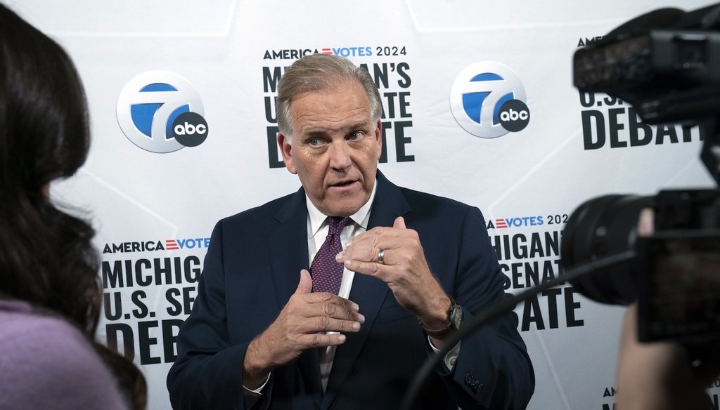 Former U.S. Rep. Mike Rogers the Republican candidate vying for the open Michigan U.S. Senate seat, answers questions by the media after he debated U.S. Rep. Elissa Slotkin, D-Holly, Monday, Oct. 14, 2024. (Detroit Free Press via AP)