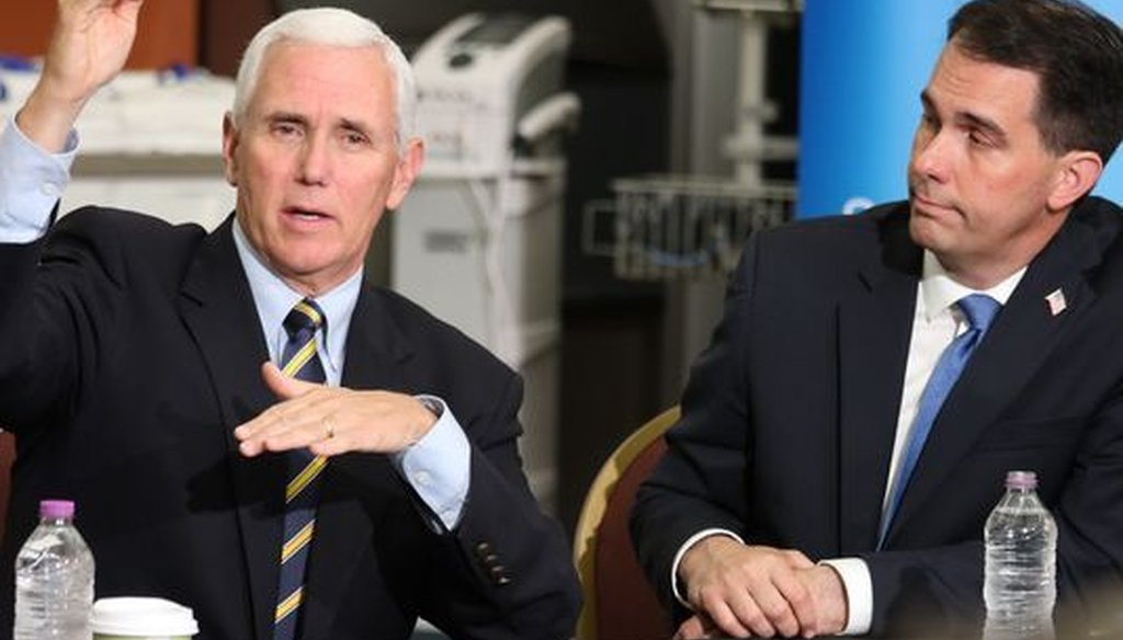 Vice President Mike Pence (left), who was joined by Wisconsin Gov. Scott Walker, appeared in Milwaukee on June 10, 2017. Pence bashed Obamacare and promised that Republicans would deliver a better replacement. (Pat A. Robinson/Milwaukee Journal Sentinel) 