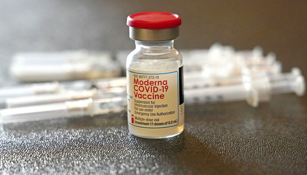 A vial filled with the Moderna COVID-19 vaccine rests by syringes waiting to be loaded by nurses from the Jackson-Hinds Comprehensive Health Center, at a vaccination station next to Jackson State University in Jackson, Miss., Tuesday, Dec. 7, 2021. (AP)