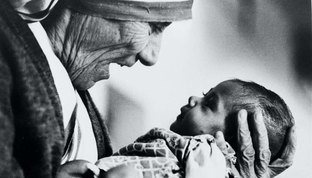 Mother Teresa, head of the Missionaries of Charity order, cradles an armless baby girl at her order's orphanage in Calcutta, India in 1978. She received the Nobel Peace Prize in 1979 and died Sept. 5, 1997, at the age of 87. (AP Photo/Eddie Adams)