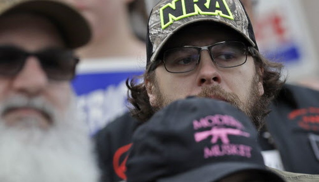 An attendee at a gun-rights rally wears a hat supporting the National Rifle Association Jan. 18, 2019, in Olympia, Wash. (Associated Press.)