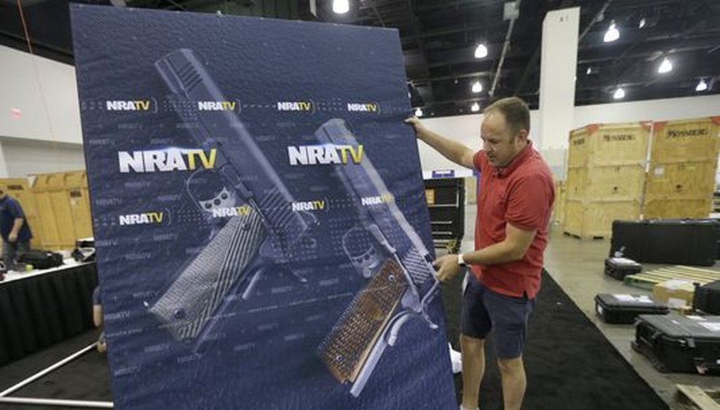 An NRA TV videographer helps set up for the NRA Carry Guard Expo in Milwaukee. (Mike De Sisti/Milwaukee Journal Sentinel)