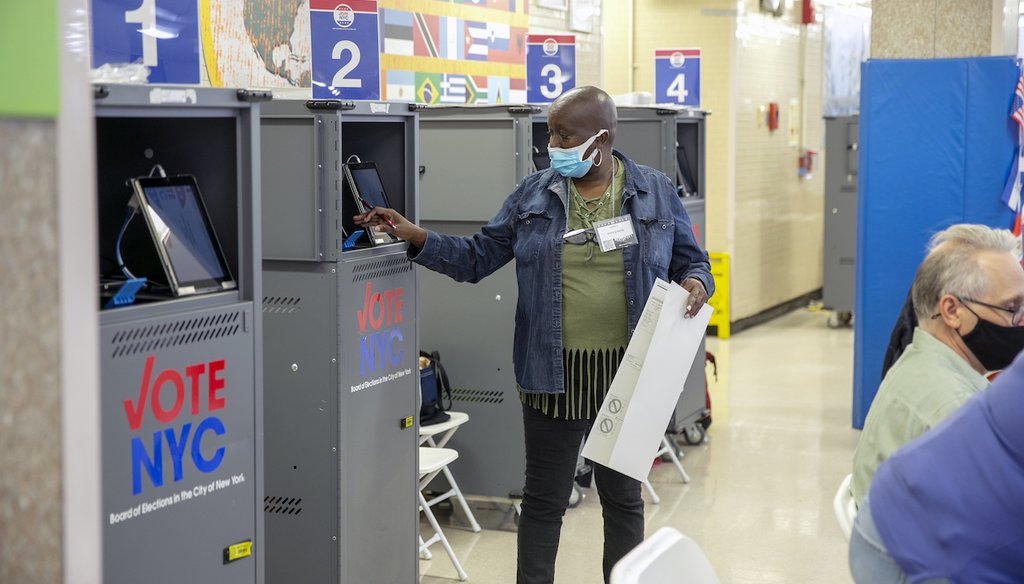 A poll worker prints a ballot from a Board of Elections printing machine at an early voting polling site at Frank McCourt High School on the Upper West Side of Manhattan in New York City on Tuesday, November 1, 2022. (AP)