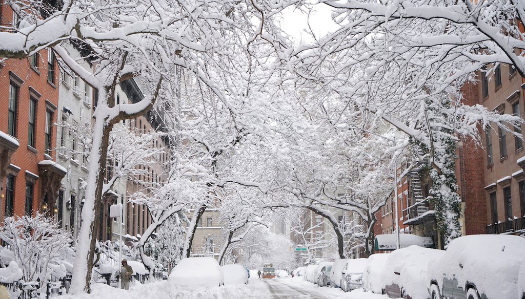 A snow plow crosses Second Avenue and heads down 19th Street to clear it after a snowstorm, Feb. 23, 2026, in New York. (AP)