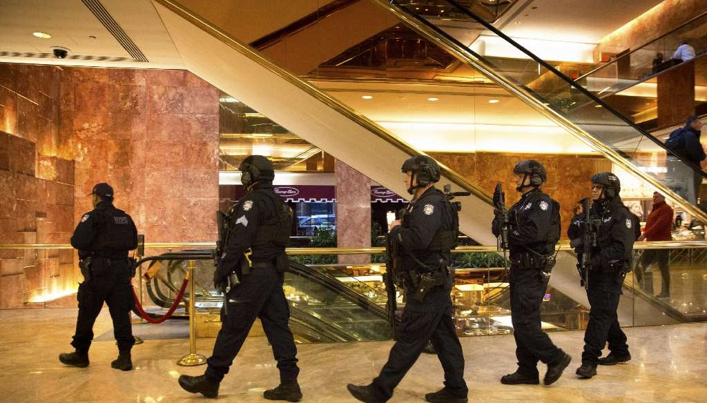 New York Police Department officers patrol the lobby of Trump Tower, on Fifth Avenue in Manhattan, Jan. 11, 2017. (Kevin Hagen/The New York Times) 