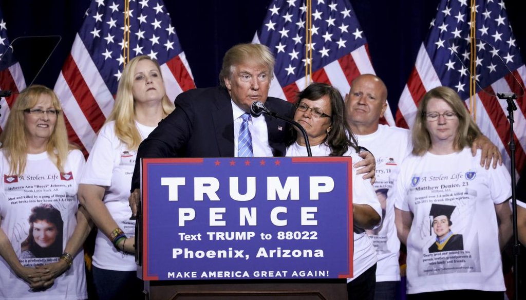 Donald Trump, the Republican presidential nominee, with "Angel Moms," parents who say their children were killed by illegal immigrants, during a campaign event focused on immigration policy in Phoenix, Aug. 31, 2016. (New York Times)