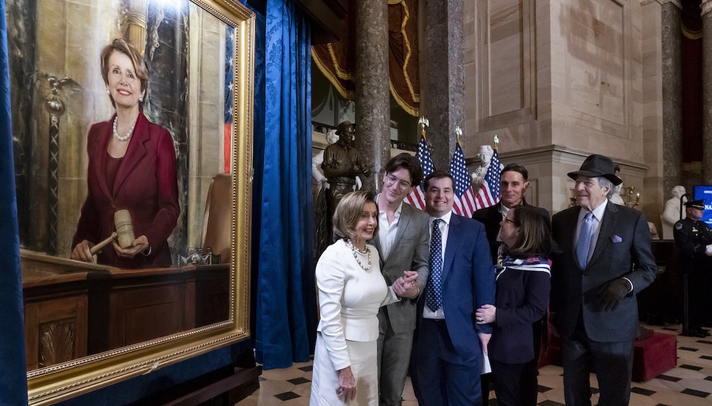 Speaker of the House Nancy Pelosi, D-Calif., is joined by her family and husband Paul Pelosi, far right, as they attend her portrait unveiling ceremony at the Capitol in Washington, Wednesday, Dec. 14, 2022. (AP photo)