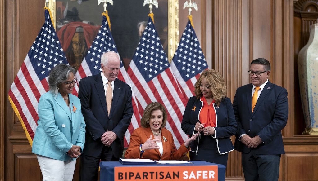 Speaker of the House Nancy Pelosi, D-Calif., seated at center, is joined by, from left, Rep. Robin Kelly, D-Ill., Rep. Mike Thompson, D-Calif., chairman of the House Gun Violence Prevention Task Force, Rep. Lucy McBath, D-Ga., and Rep. Salud Carbajal, D-C