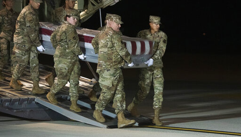 An Air Force carry team moves the transfer case containing the remains of Navy Seaman Apprentice Cameron Scott Walters, of Richmond Hill, Ga., Dec. 8, 2019, at Dover Air Force Base.  A Saudi gunman killed three people at the Naval base in Pensacola. (AP)