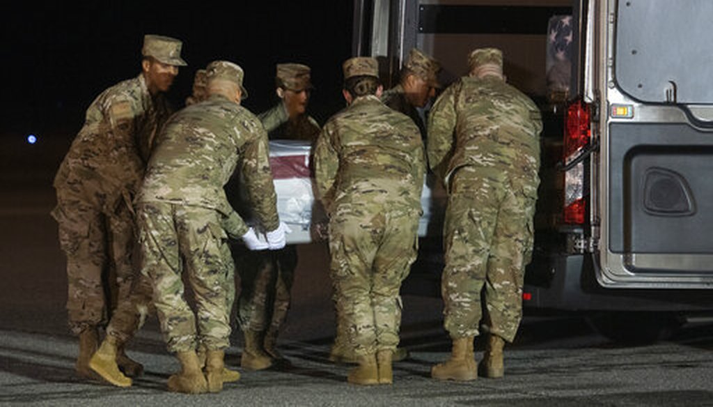 An Air Force carry team moves a transfer case containing the remains of Navy Seaman Mohammed Sameh Haitham, of St. Petersburg, Fla., Dec. 8, 2019, at Dover Air Force Base, Del. A Saudi gunman killed three people including Haitham in a shooting. (AP)