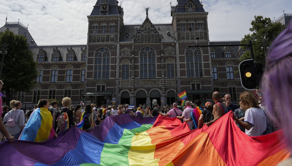 Tens of thousand passed Rijksmuseum, rear, during the Pride Walk in Amsterdam, Netherlands, Saturday, July 30, 2022, calling for equal rights for members of the LGBTI community in countries where homosexuality is included in the penal code. (AP)