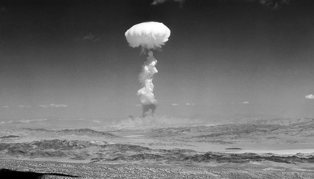 In this April 22, 1952 file photo a gigantic pillar of smoke with the familiar mushroom top climbs above Yucca Flat, Nev. during nuclear test detonation. (AP)