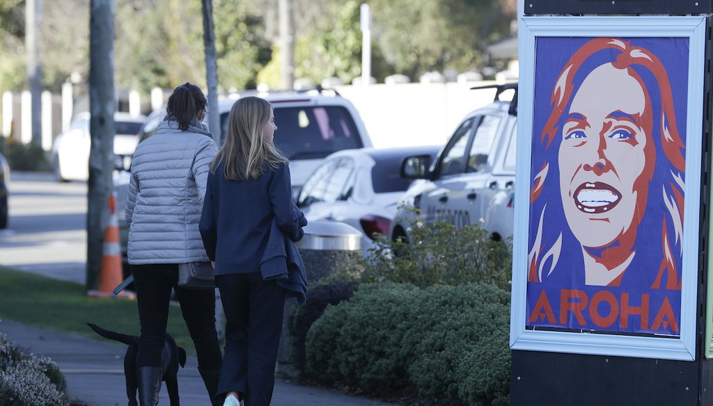 Pedestrians walk past a billboard featuring Prime Minister Jacinda Ardern with the word Aroha, meaning love, in Christchurch, New Zealand, on June 8, 2020. New Zealand has largely eradicated the novel coronavirus. (AP)