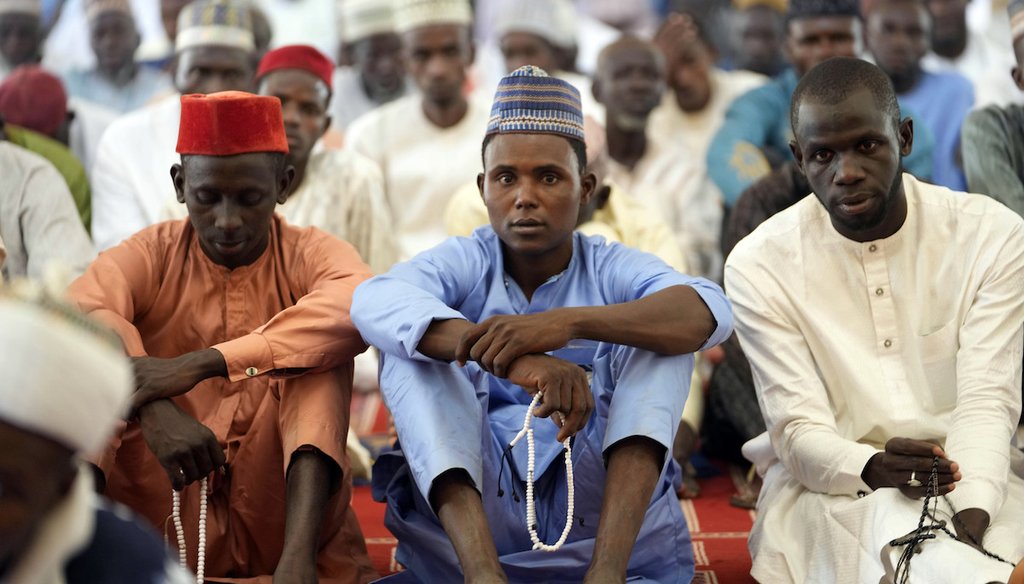 Muslim faithful listen to a sermons by an Imam, before a traditional Friday prayers at the Moddibo Adama Mosque in Yola Nigeria, Friday, Feb. 24, 2023. (AP)