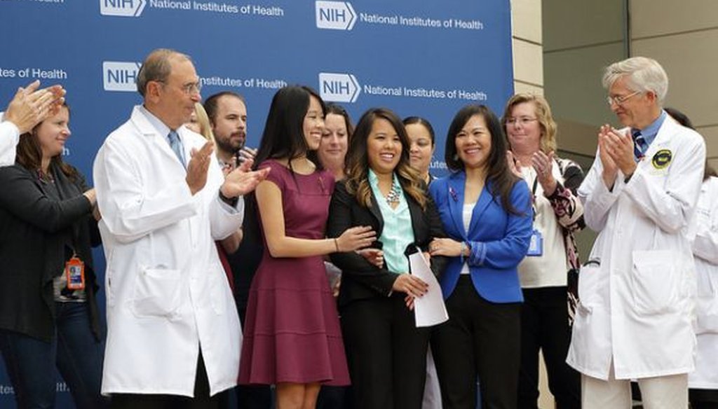 Ebola patient Nina Pham (center) with her family and supporters after a press briefing on her release from the National Institutes of Health in Bethesda, Md., on Oct. 24, 2014. (NIH photo)