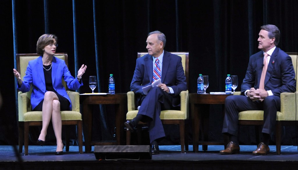 U.S. Senate candidates Michelle Nunn and David Perdue discuss their platforms in an August forum sponsored by the Georgia Chamber at the Marriott City Center in Macon. Photo by AJC Photographer Kent D. Johnson.