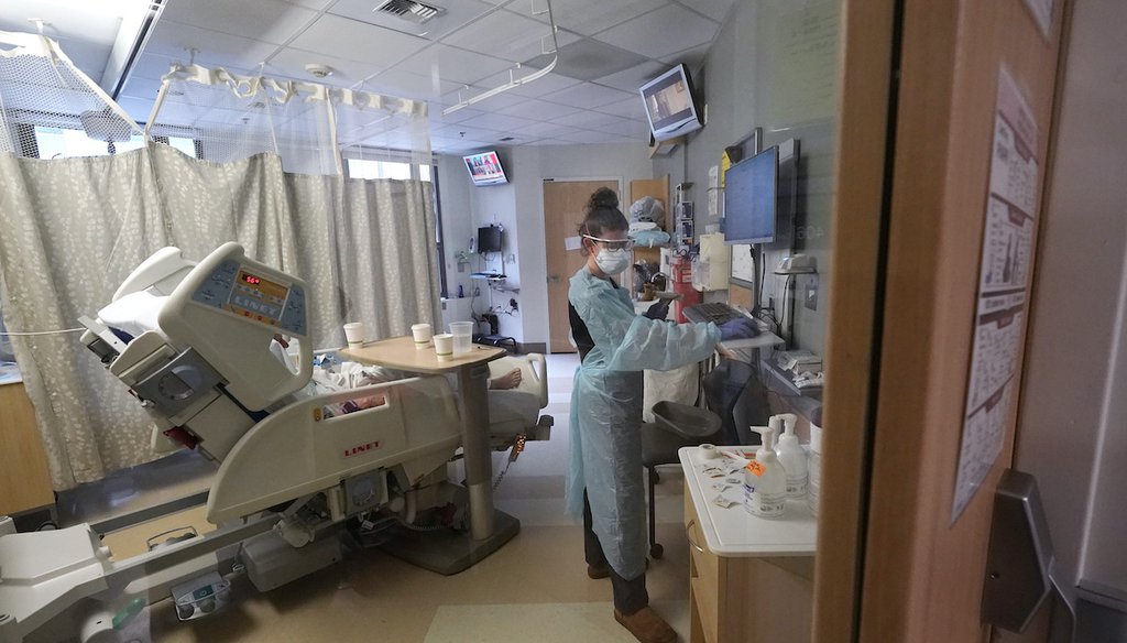 A nurse cares for a COVID-19 patient in an acute care unit, Jan. 14, 2022. (AP)