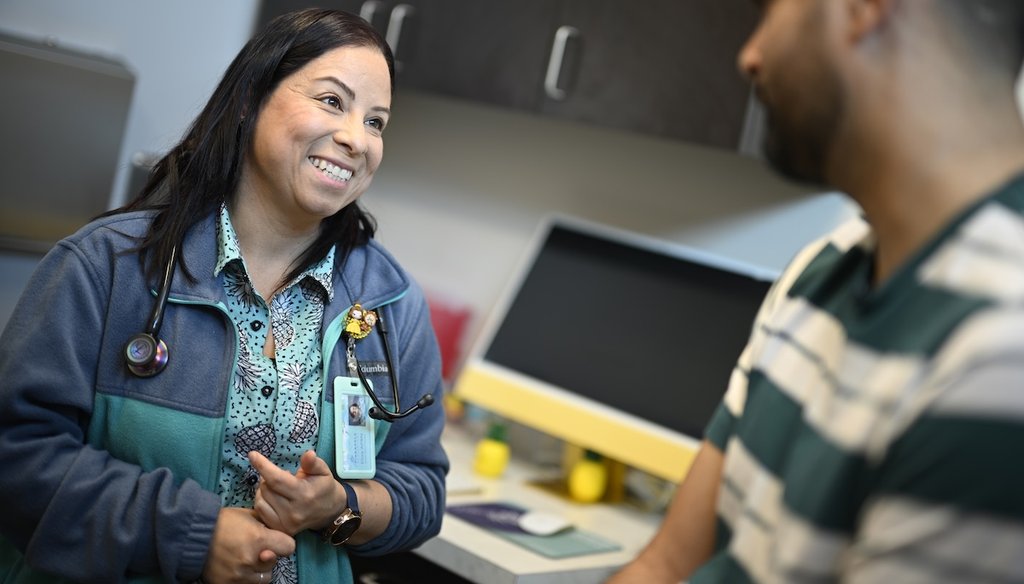 Nurse practitioner Eliza Otero, left, talks with Fernando Hermida at Pineapple Healthcare in Orlando, Fla., on May 28, 2024. (AP)