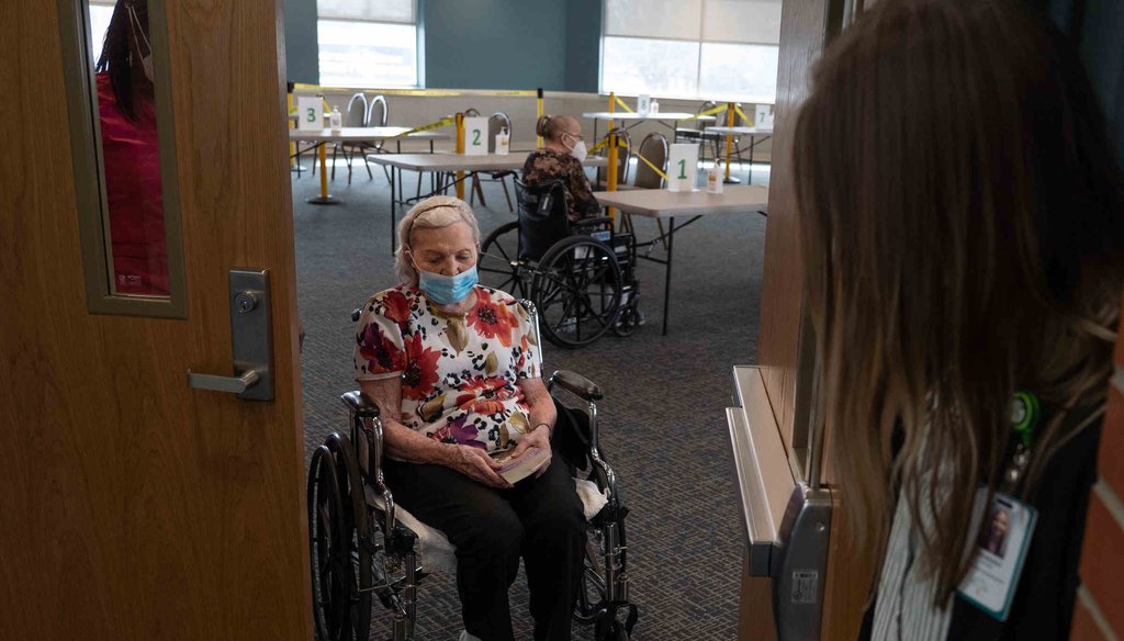 Evelyn Probst, 97, a nursing home resident at the Martha T. Berry Medical Care Facility in Mount Clemens exits the room after seeing her daughter (Detroit Free Press, Ryan Garza)